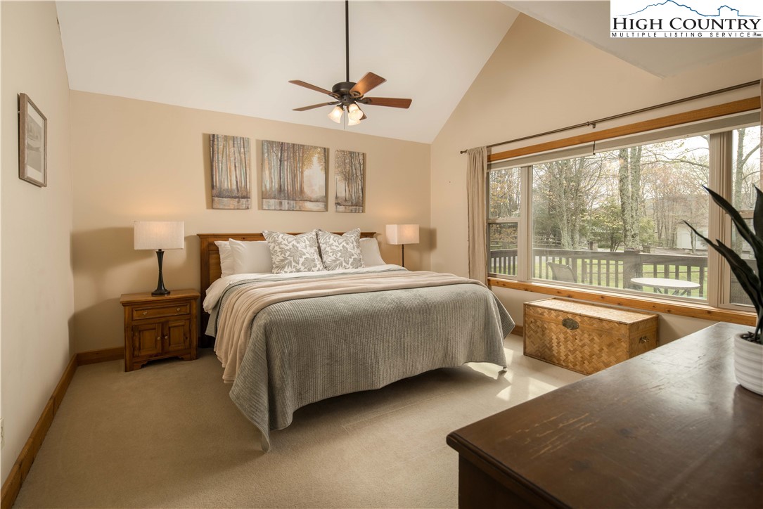 109 Old Field Road Beech Mountain, NC 28604 - Photo 24 of 50 a bedroom with a bed and a large window