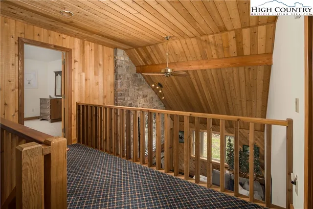 a view of a livingroom with furniture and hardwood floor
