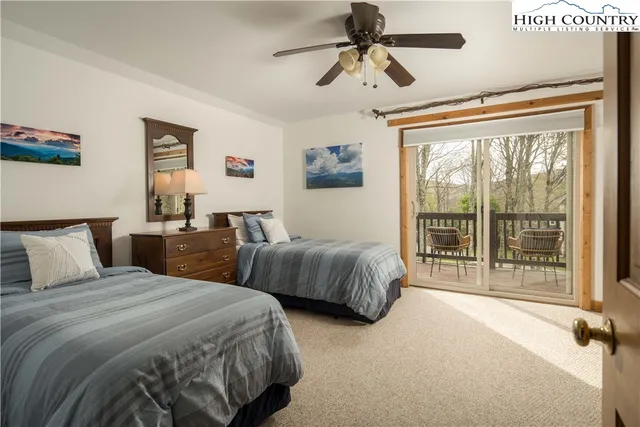 a view of a two chairs in the balcony