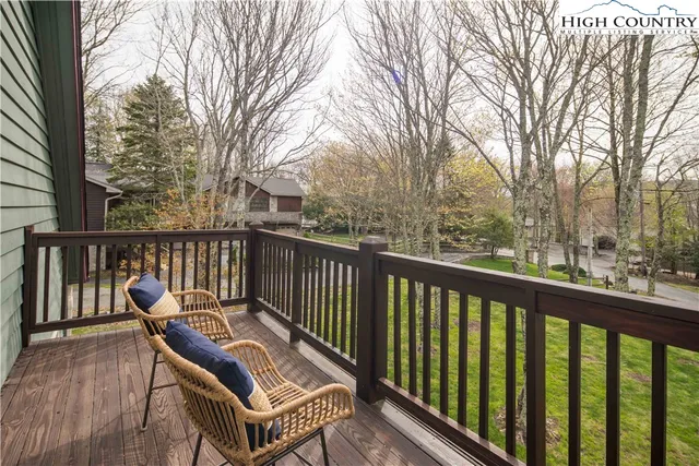 a view of a grassy field with mountain