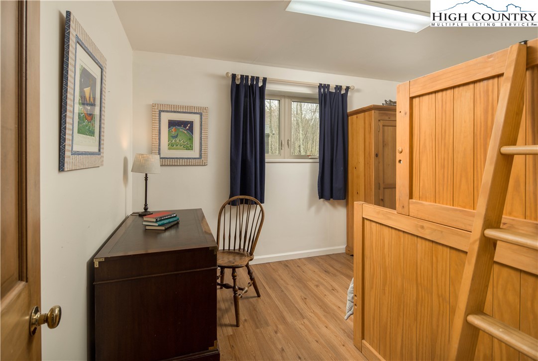 109 Old Field Road Beech Mountain, NC 28604 - Photo 36 of 50 a view of a livingroom with furniture and hardwood floor