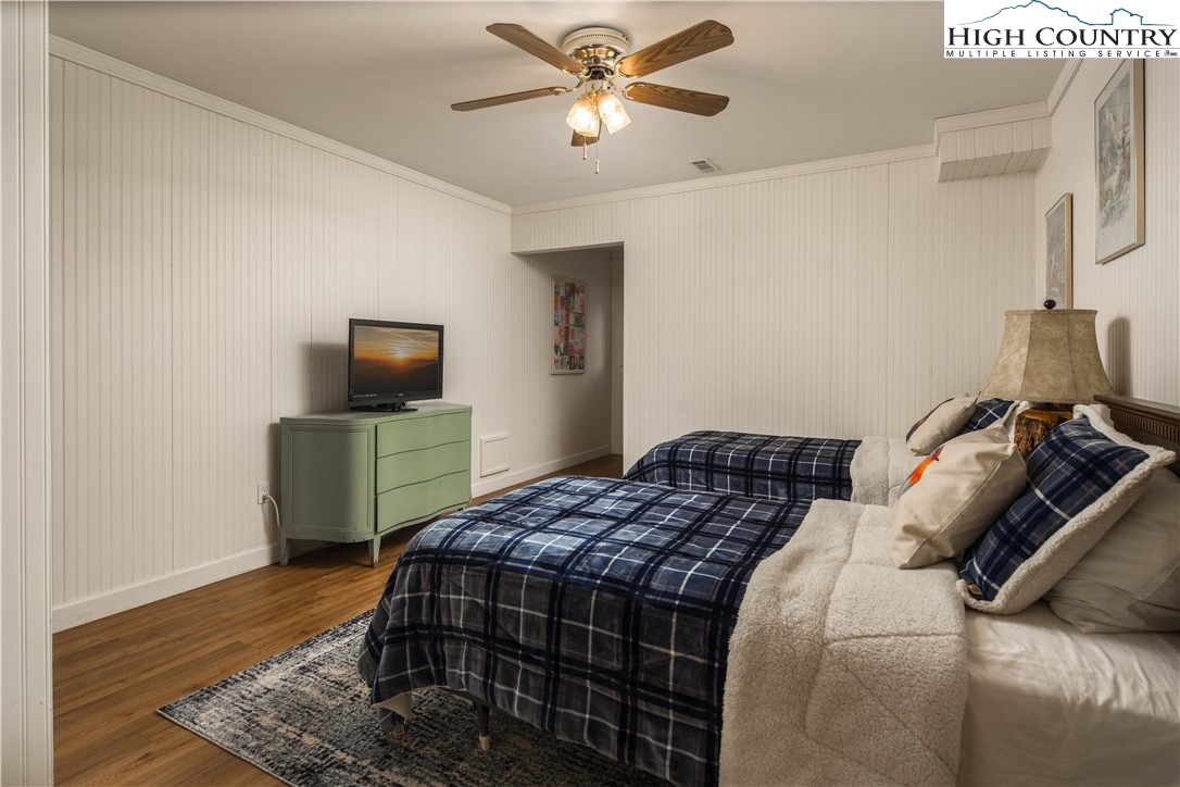 109 Old Field Road Beech Mountain, NC 28604 - Photo 37 of 50 a bedroom with a bed and flat screen tv
