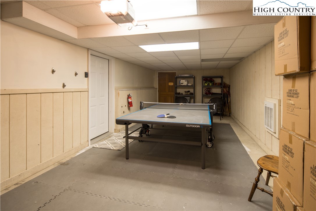 109 Old Field Road Beech Mountain, NC 28604 - Photo 39 of 50 a room with furniture a rug and white walls