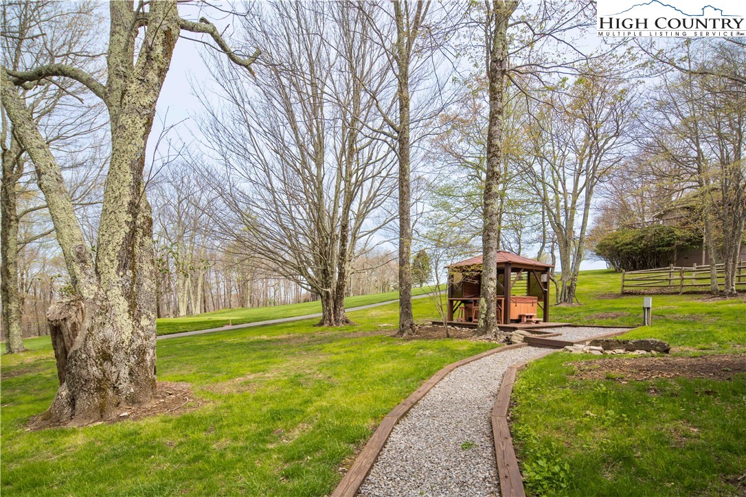 109 Old Field Road Beech Mountain, NC 28604 - Photo 40 of 50 a view of a house with a big yard plants and large trees