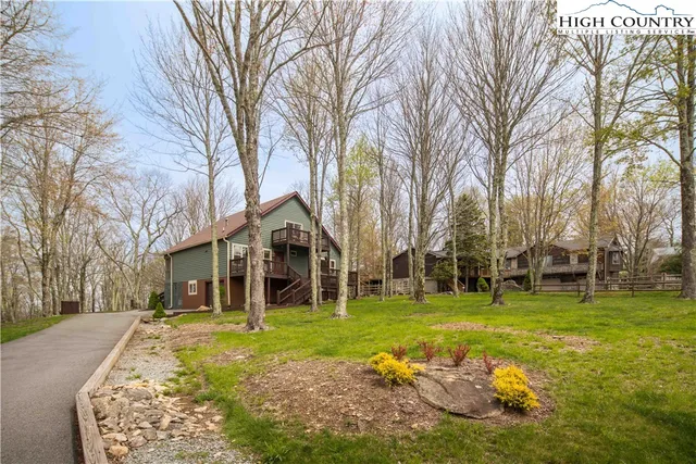 a view of a two chairs in the balcony