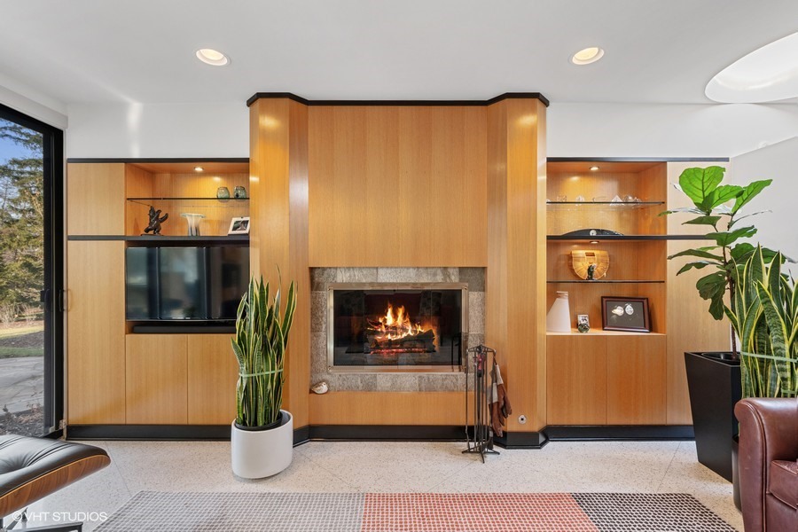 1700 Ridge Road Highland Park, IL 60035 - Photo 17 of 56 a living room with a fireplace a potted plant and a fireplace
