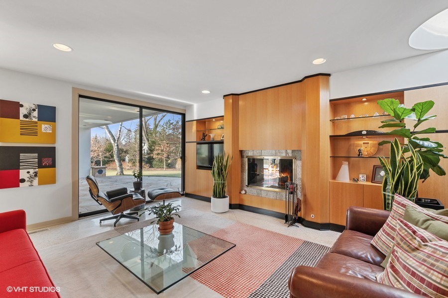 1700 Ridge Road Highland Park, IL 60035 - Photo 19 of 56 a living room with furniture floor to ceiling window and a flat screen tv