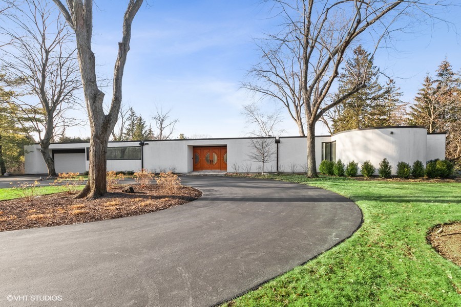 1700 Ridge Road Highland Park, IL 60035 - Photo 2 of 56 a view of a street with a house and a road