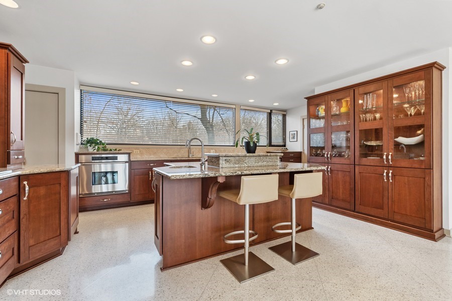 1700 Ridge Road Highland Park, IL 60035 - Photo 26 of 56 a kitchen with a sink a counter top space stainless steel appliances and cabinets