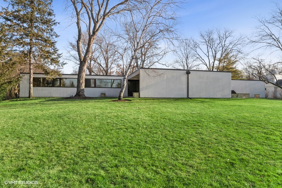 1700 Ridge Road Highland Park, IL 60035 - Photo 3 of 56 a view of a house with a big yard and large trees