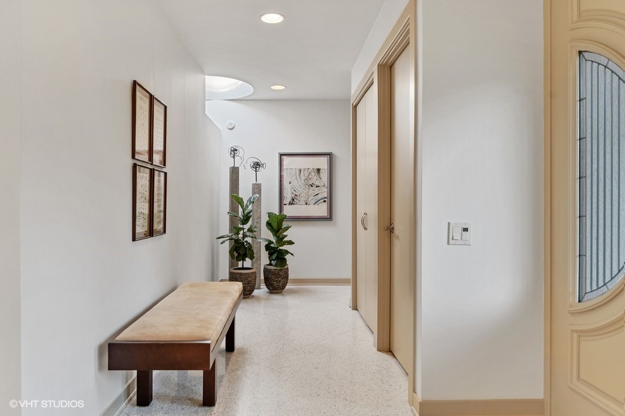 1700 Ridge Road Highland Park, IL 60035 - Photo 31 of 56 a view of a hallway with workspace and mirror in a room