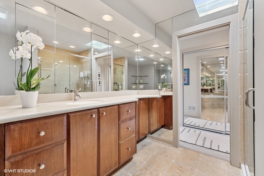 1700 Ridge Road Highland Park, IL 60035 - Photo 37 of 56 a spacious bathroom with a double vanity sink and a mirror