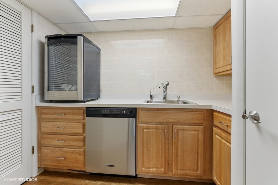 1700 Ridge Road Highland Park, IL 60035 - Photo 46 of 56 a kitchen with a sink and a mirror