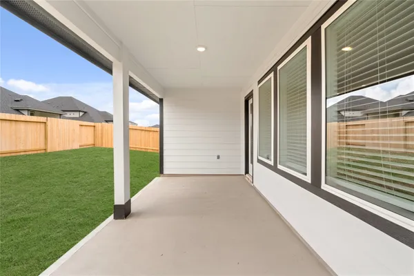 a view of a back yard with porch