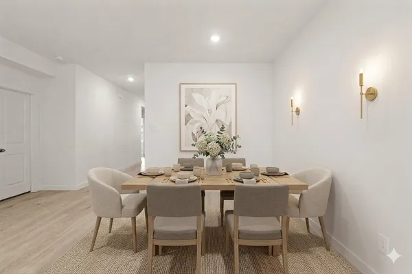 a dining room with furniture and wooden floor