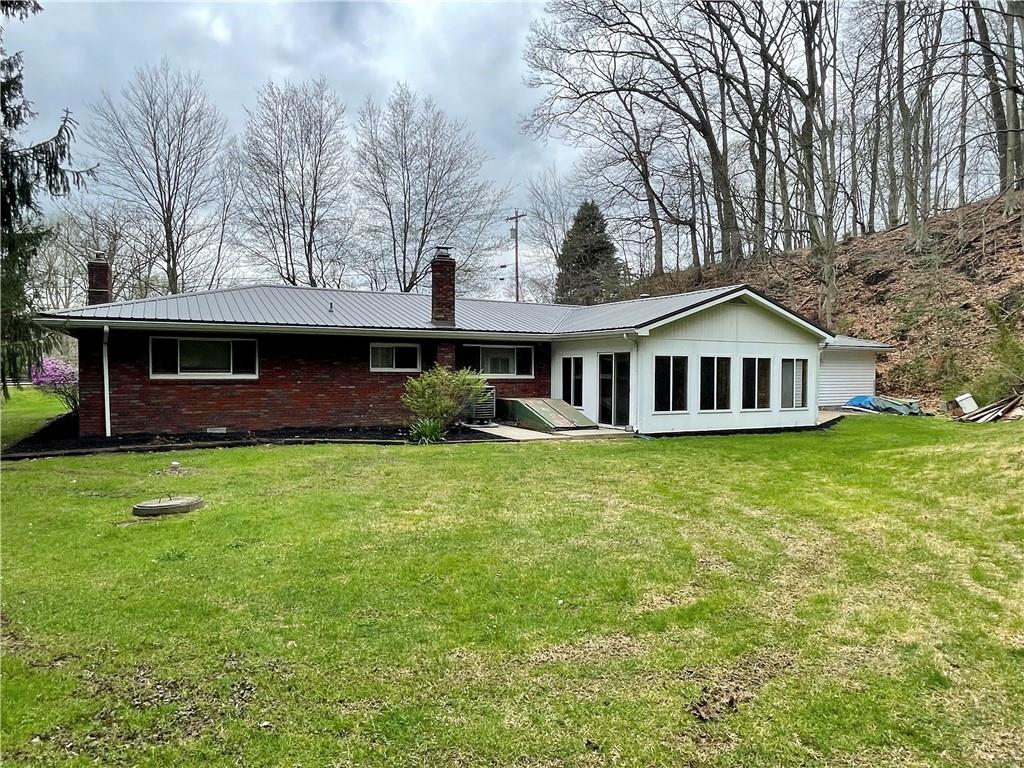 2774 Pulaski Road New Castle, PA 16105 - Photo 19 of 19 a front view of a house with a garden and deck