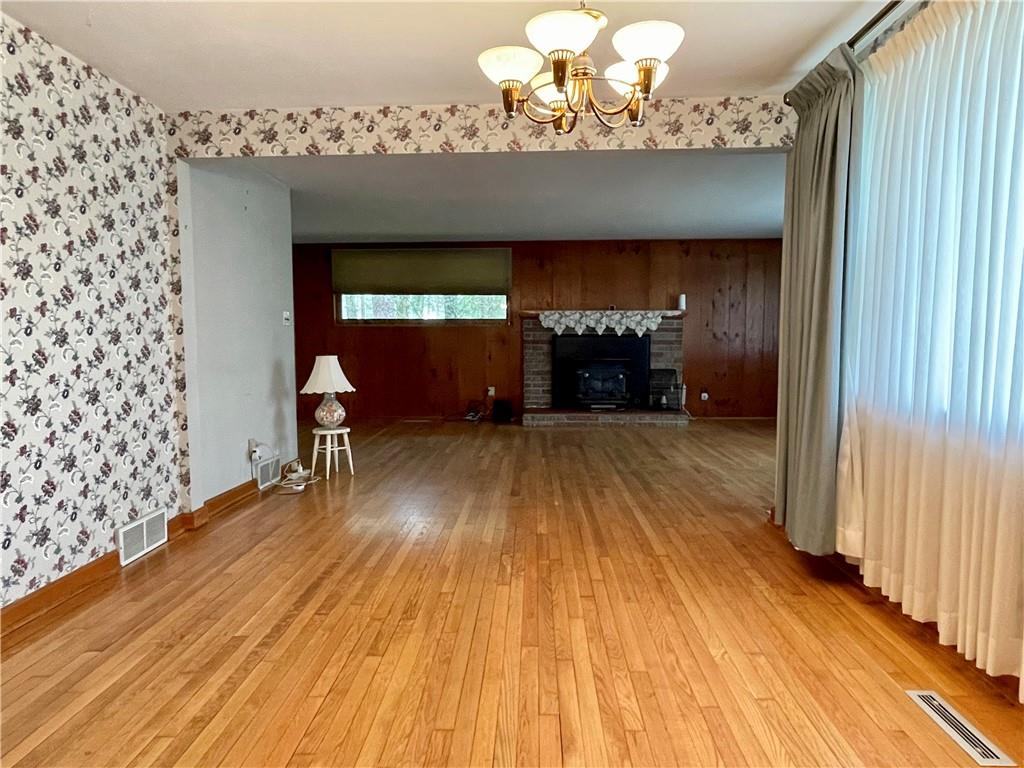 2774 Pulaski Road New Castle, PA 16105 - Photo 7 of 19 a view of a room with wooden floor lounge chair and windows