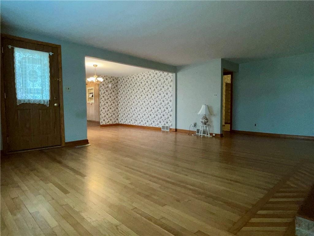 2774 Pulaski Road New Castle, PA 16105 - Photo 9 of 19 an empty room with wooden floor and windows