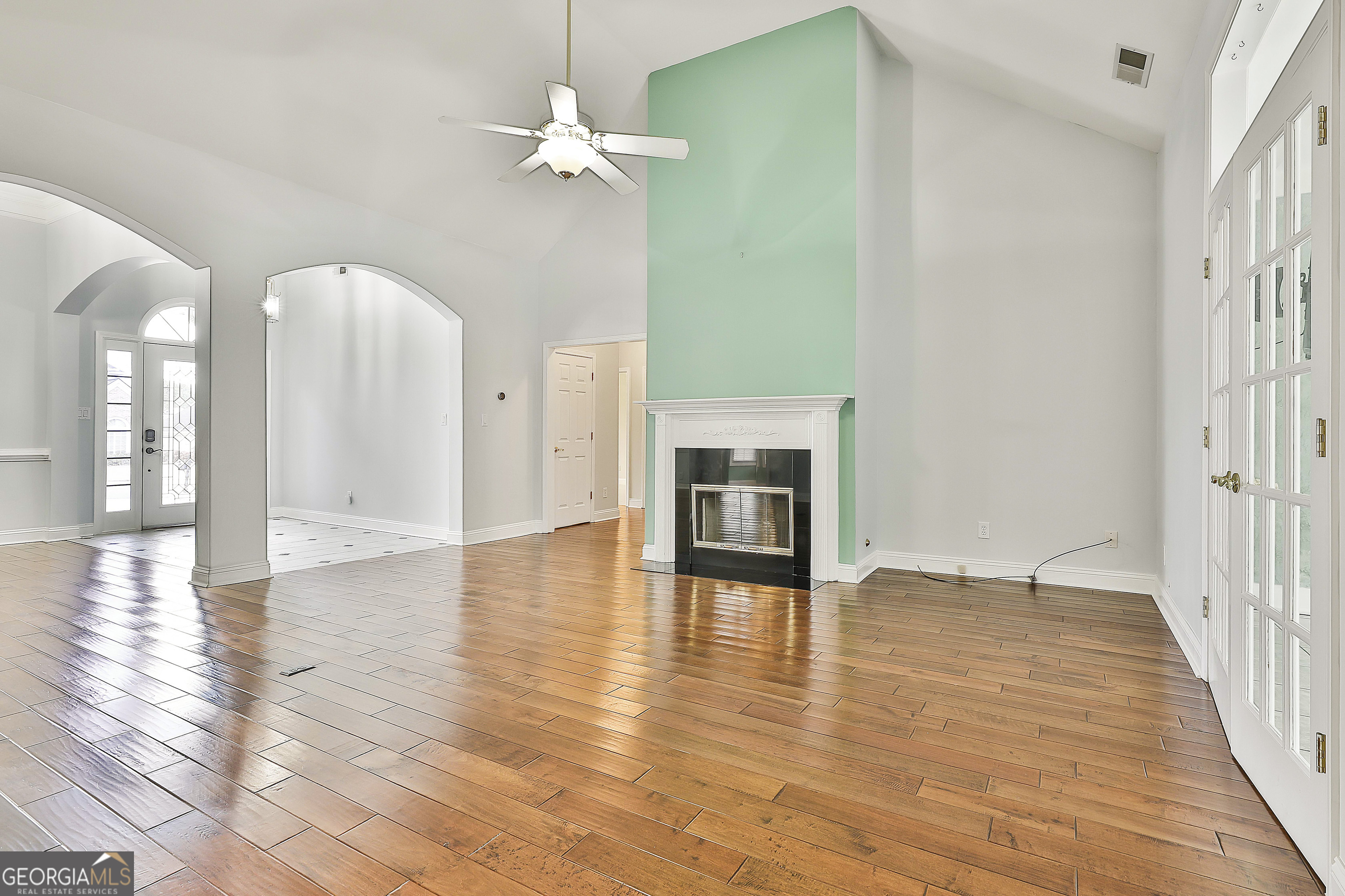 207 Prestwick Way North Stockbridge, GA 30281 - Photo 12 of 44 a view of an empty room with wooden floor and a fireplace