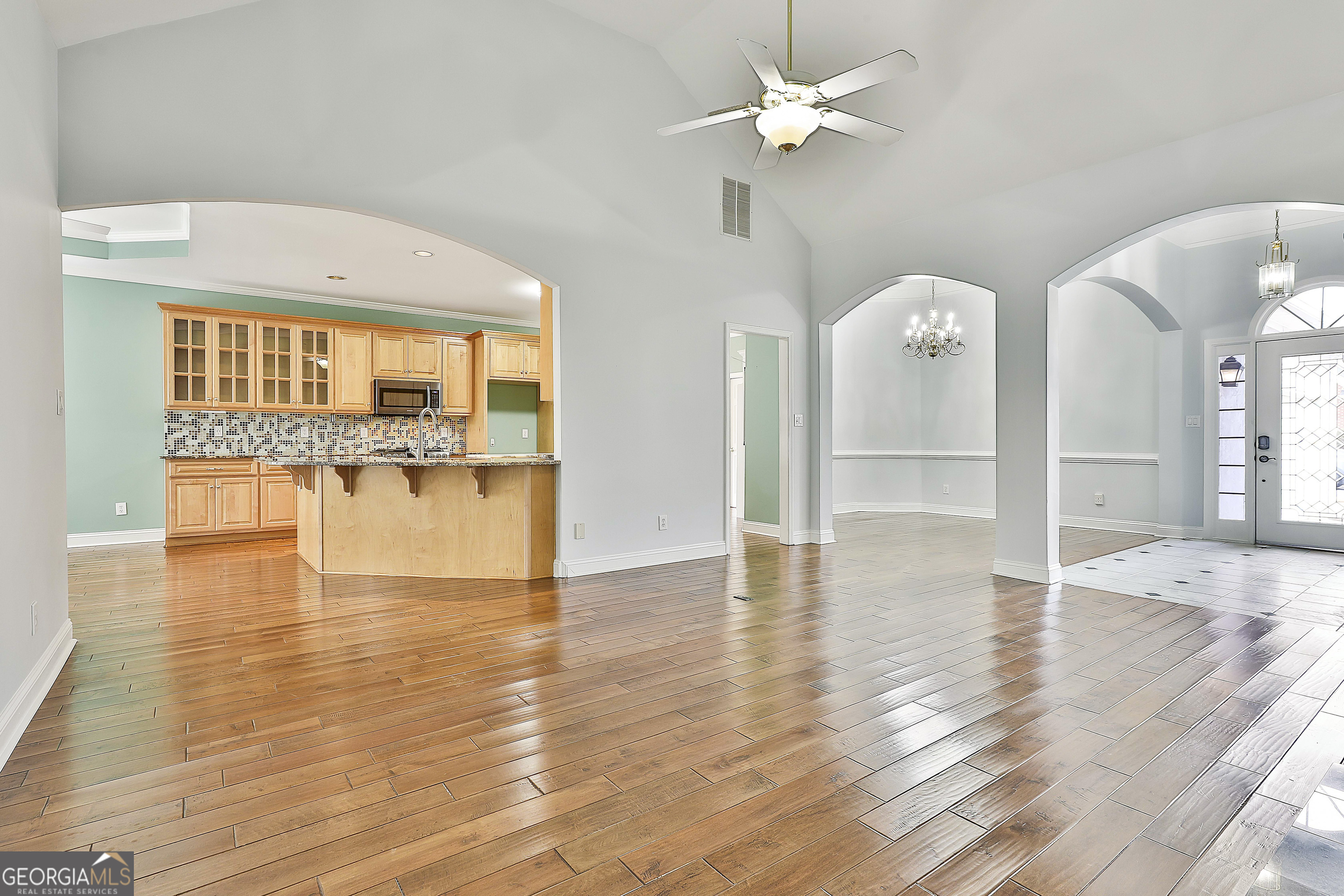 207 Prestwick Way North Stockbridge, GA 30281 - Photo 13 of 44 a view of empty room with wooden floor and fan