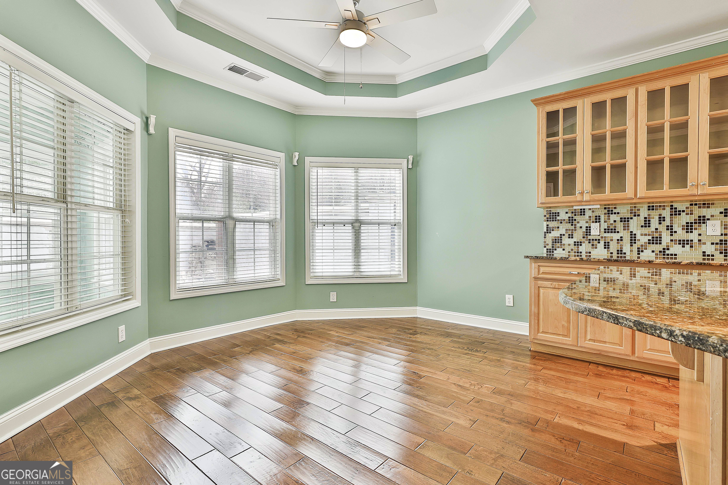 207 Prestwick Way North Stockbridge, GA 30281 - Photo 15 of 44 a view of an empty room with a window and wooden floor