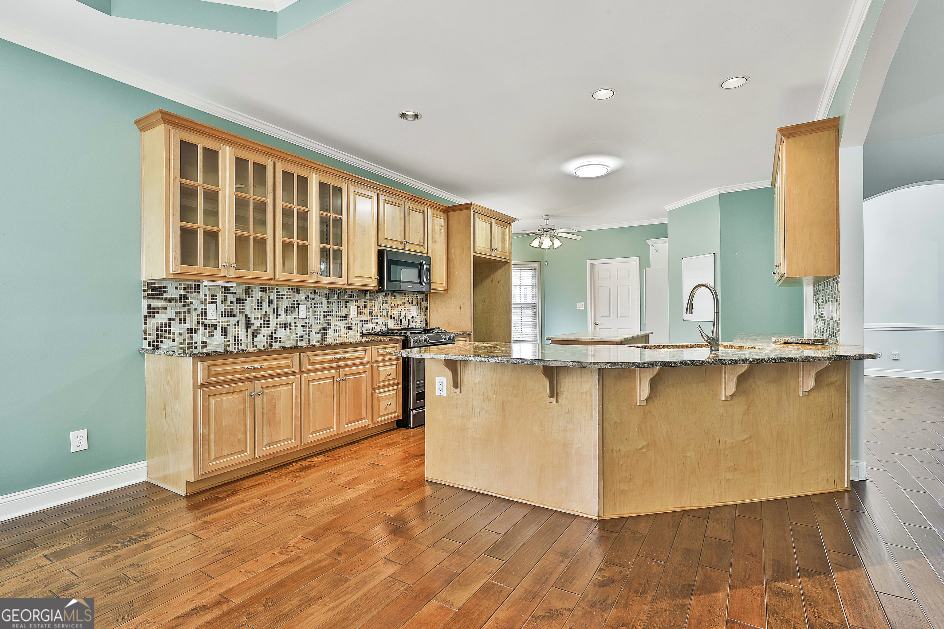 207 Prestwick Way North Stockbridge, GA 30281 - Photo 16 of 44 a kitchen with stainless steel appliances granite countertop a stove and a sink