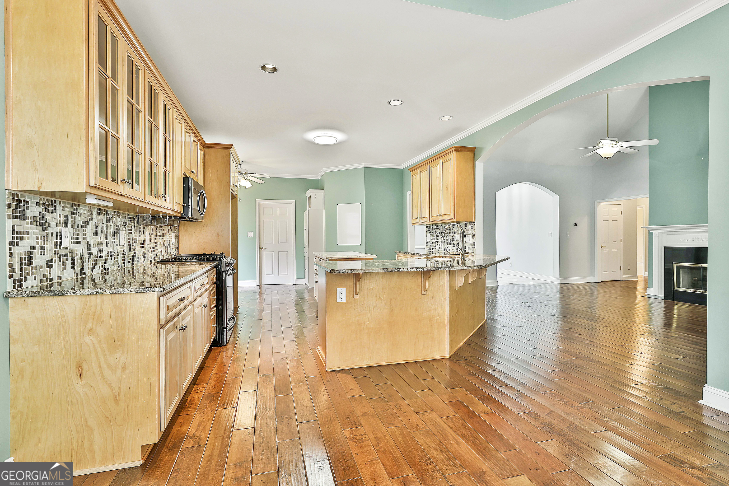 207 Prestwick Way North Stockbridge, GA 30281 - Photo 17 of 44 a large white kitchen with wooden floor and a window