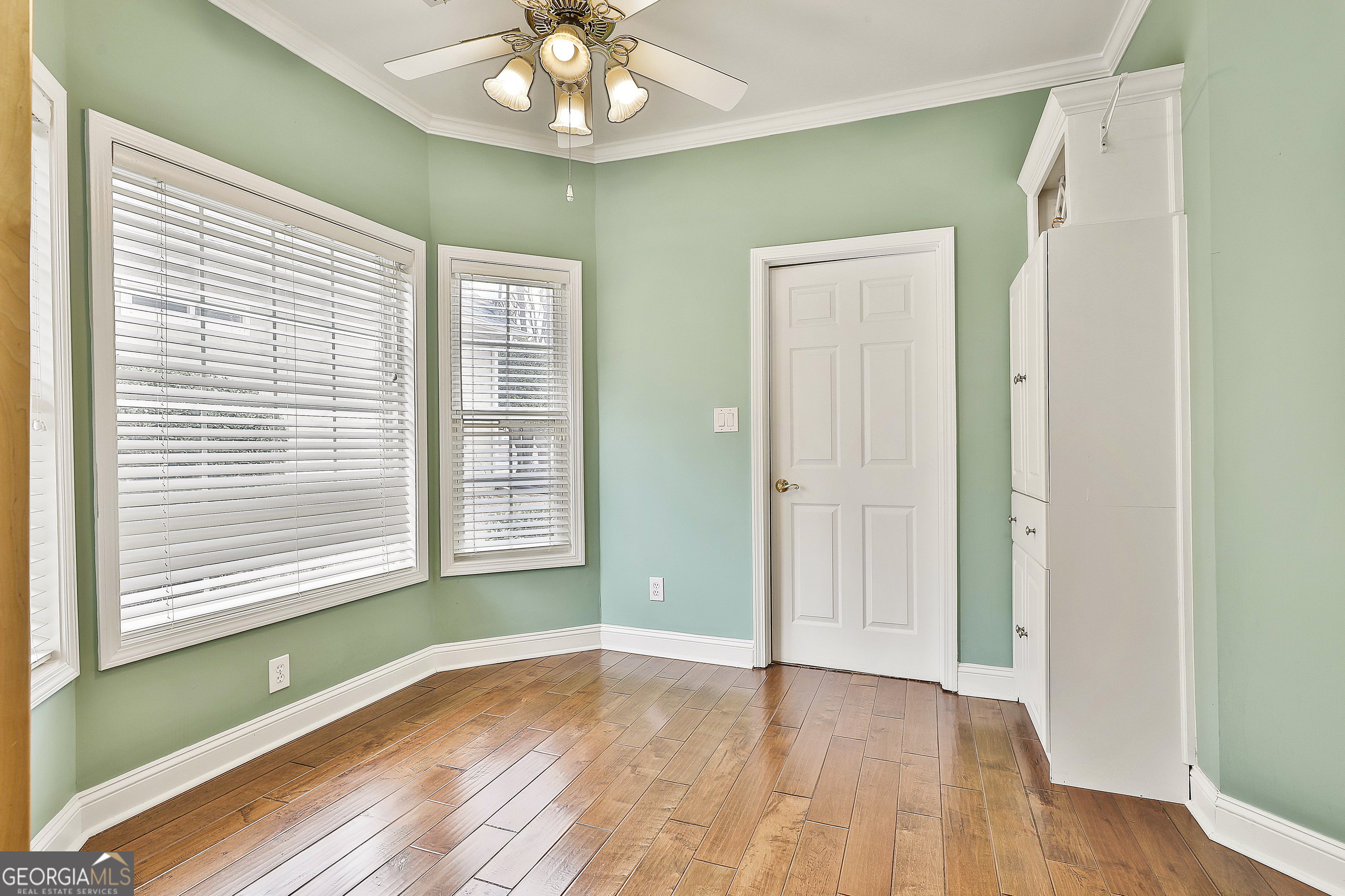207 Prestwick Way North Stockbridge, GA 30281 - Photo 20 of 44 a view of an empty room with wooden floor and a window