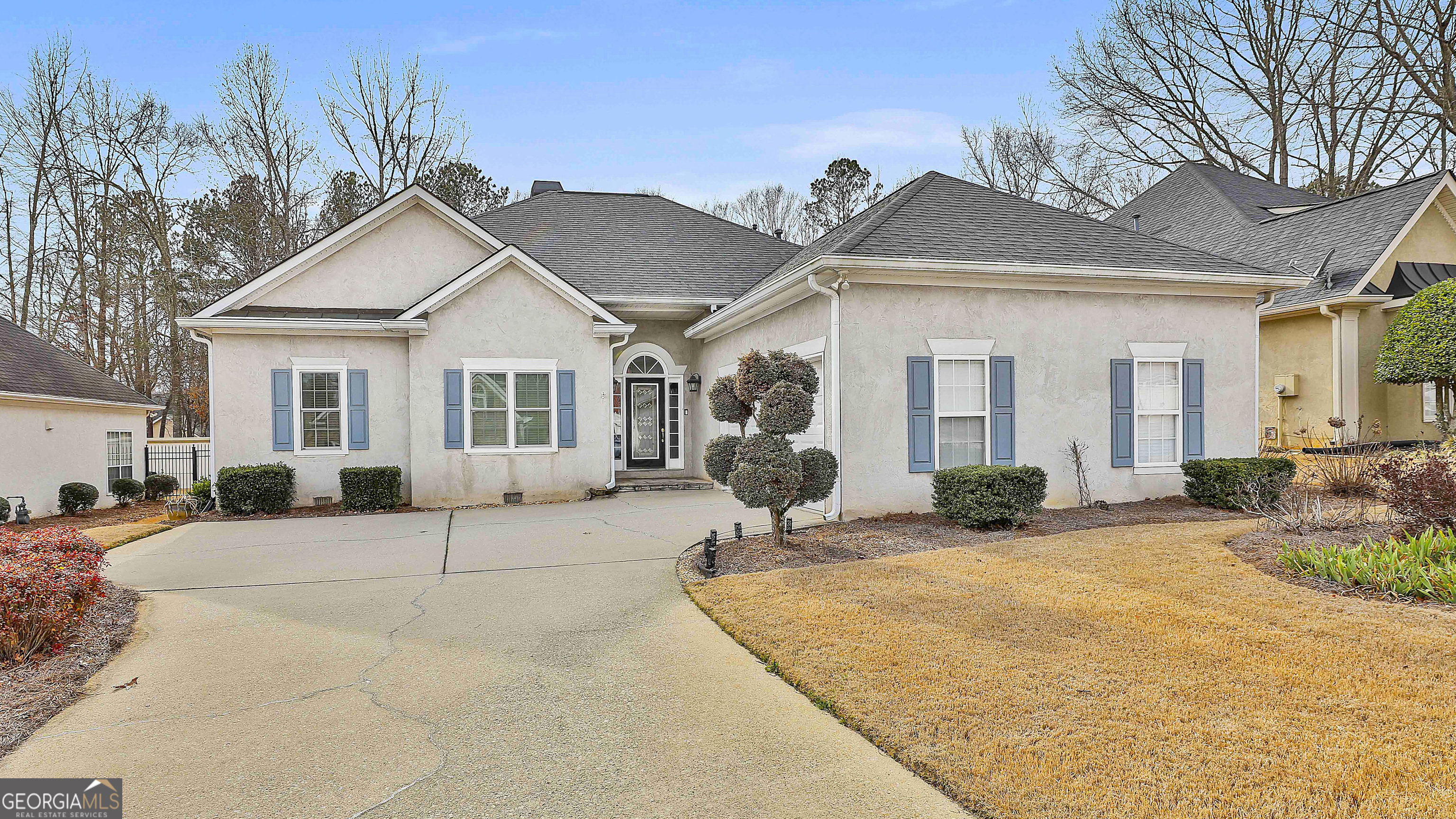 207 Prestwick Way North Stockbridge, GA 30281 - Photo 2 of 44 a view of a white house with a outdoor space