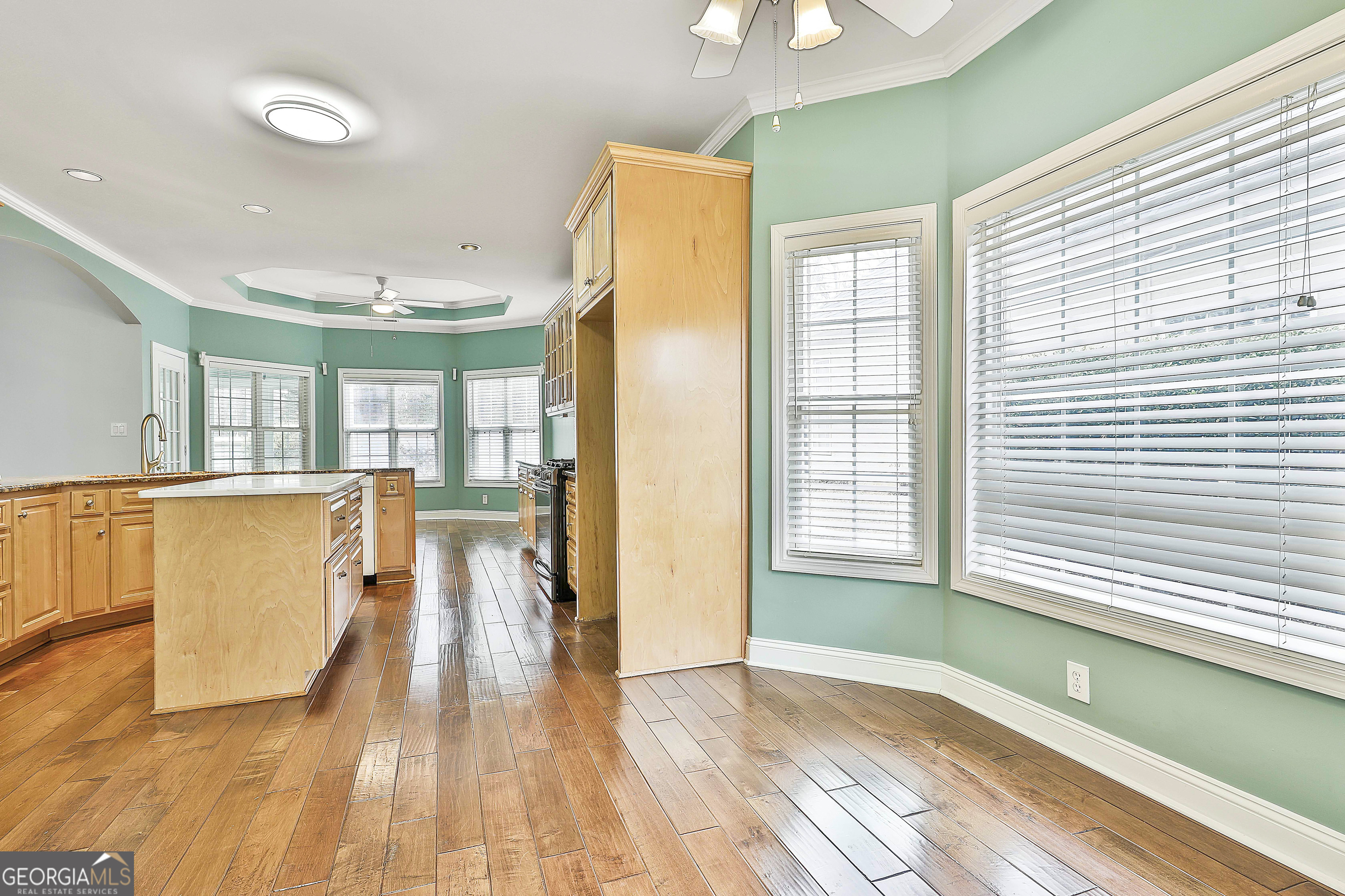 207 Prestwick Way North Stockbridge, GA 30281 - Photo 21 of 44 a view of a large kitchen with wooden floor and a window