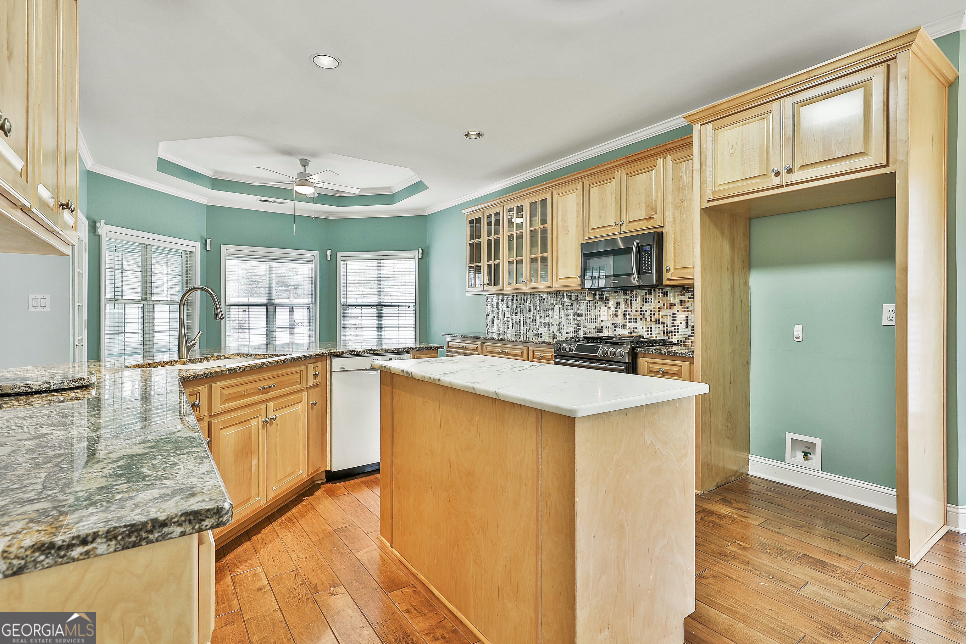 207 Prestwick Way North Stockbridge, GA 30281 - Photo 23 of 44 a kitchen with stainless steel appliances granite countertop a sink and a stove