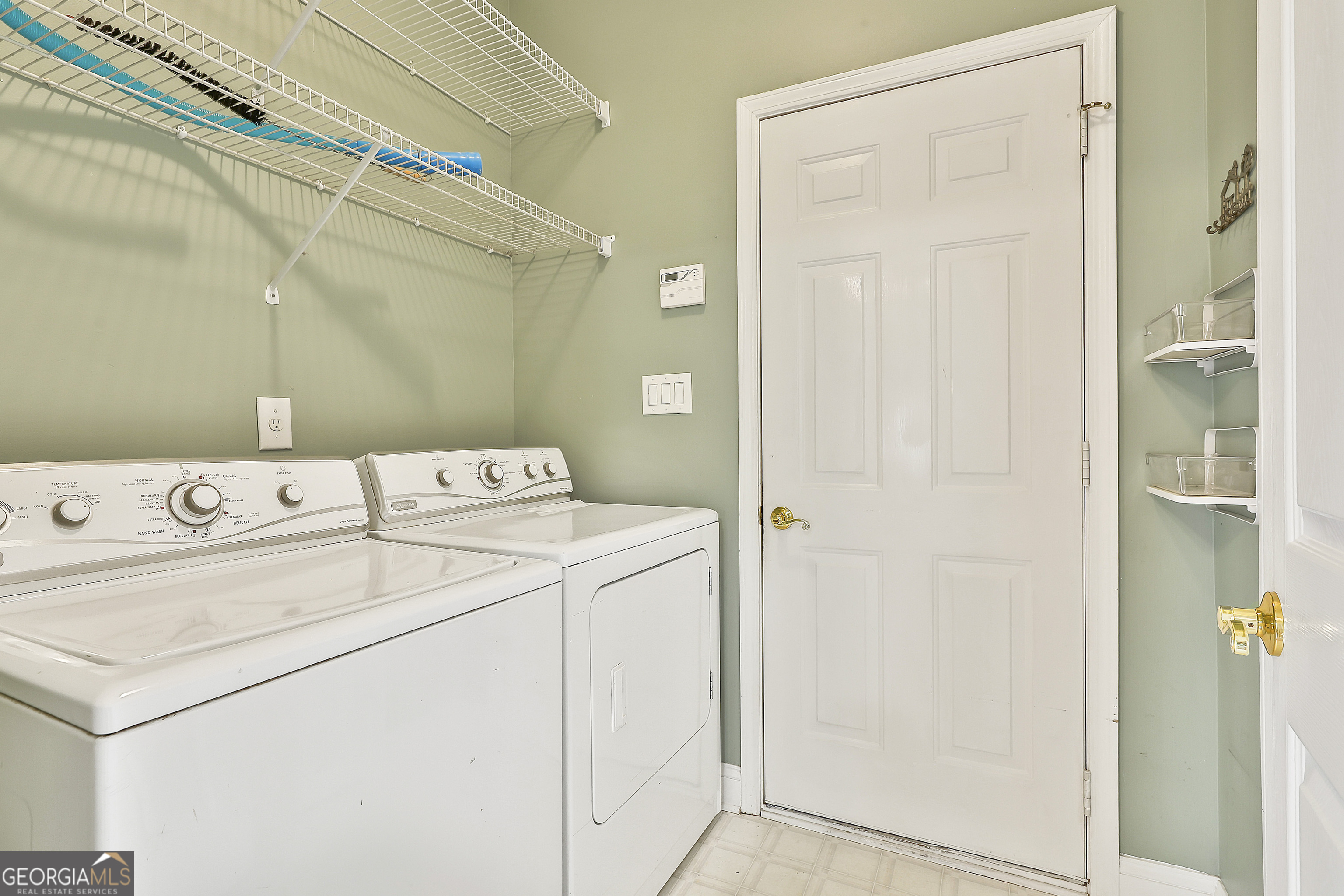 207 Prestwick Way North Stockbridge, GA 30281 - Photo 24 of 44 a utility room with dryer and washer