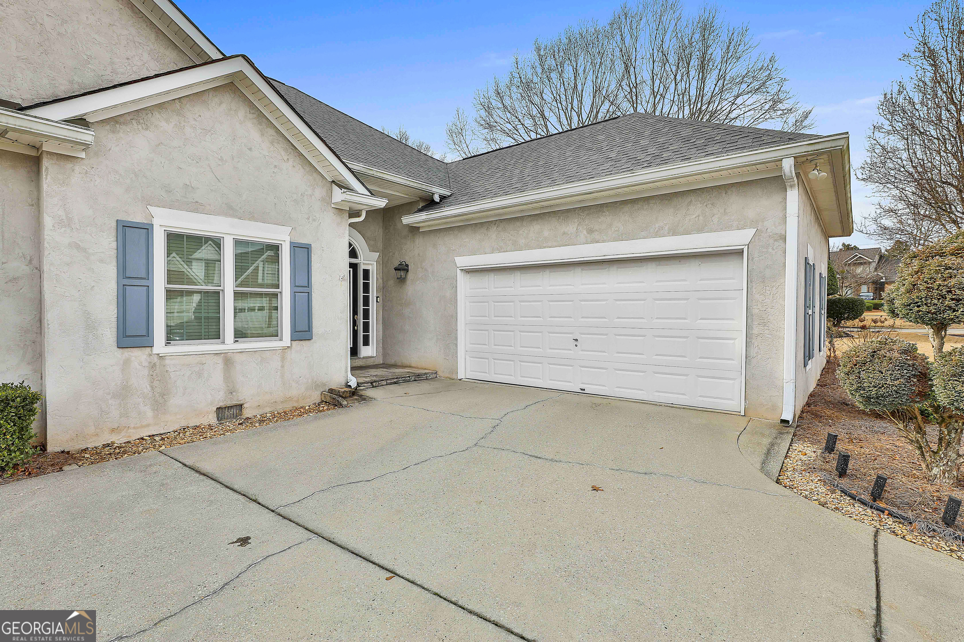 207 Prestwick Way North Stockbridge, GA 30281 - Photo 3 of 44 a front view of a house with a garage