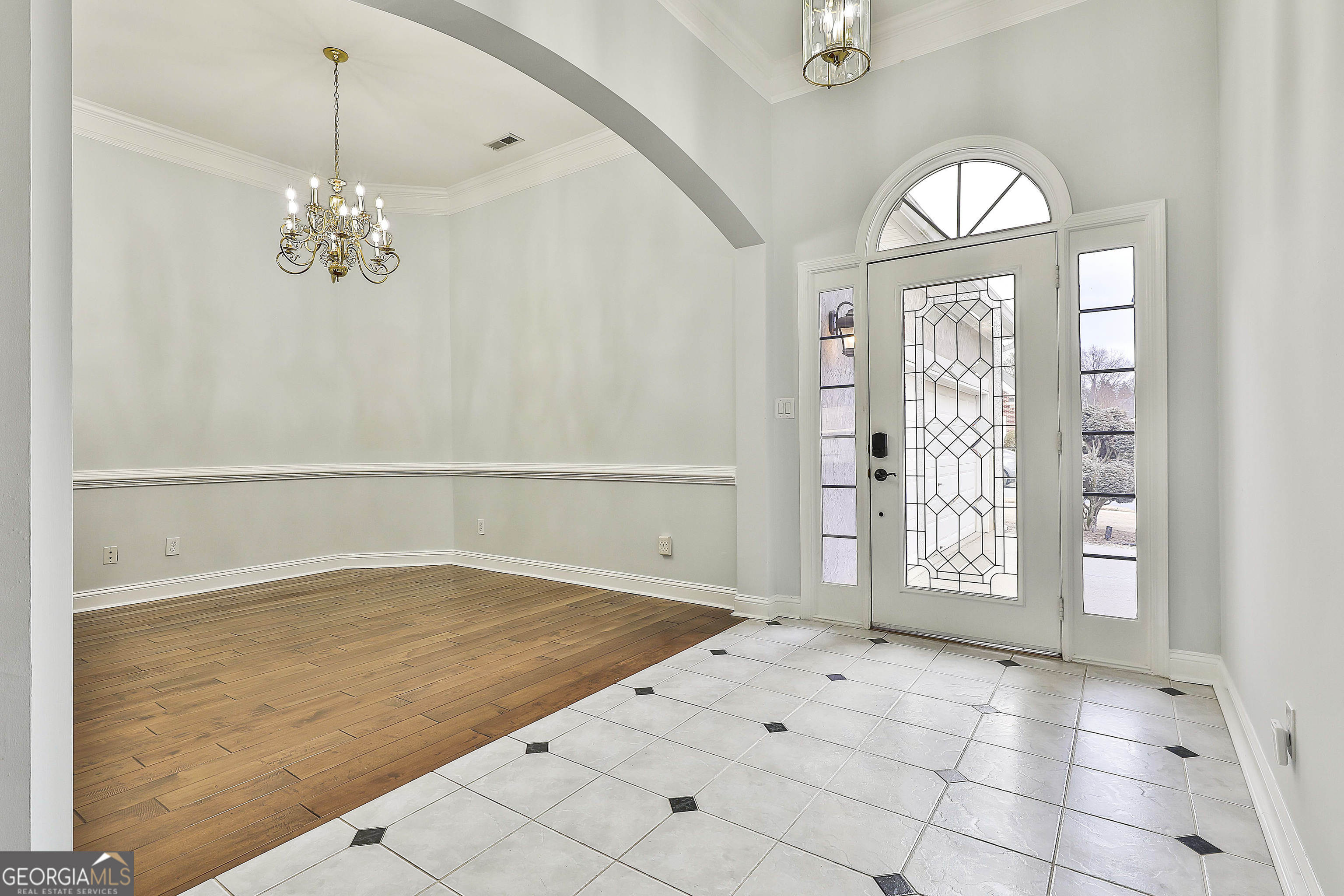 207 Prestwick Way North Stockbridge, GA 30281 - Photo 7 of 44 a view of an empty room with window and chandelier fan