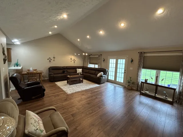 a living room with furniture window and wooden floor
