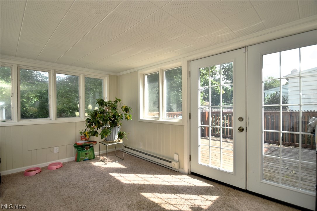 4205 Okalona Road South Euclid, OH 44121 - Photo 10 of 21 Sunroom featuring baseboard heating and plenty of natural light.