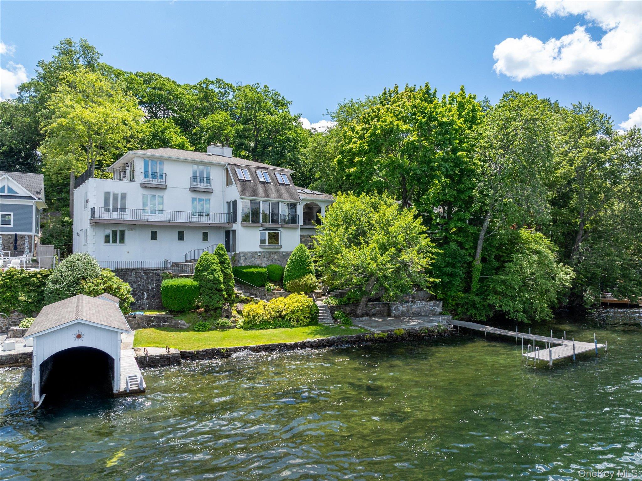 41 Tamarack Road Mahopac, NY 10541 - Photo 2 of 41 Waterfront living on Lake Mahopac with a private boathouse, dock, and west-facing sunset views