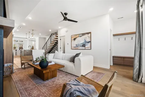 a living room with furniture and a rug
