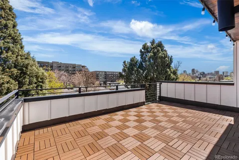 a view of balcony with furniture