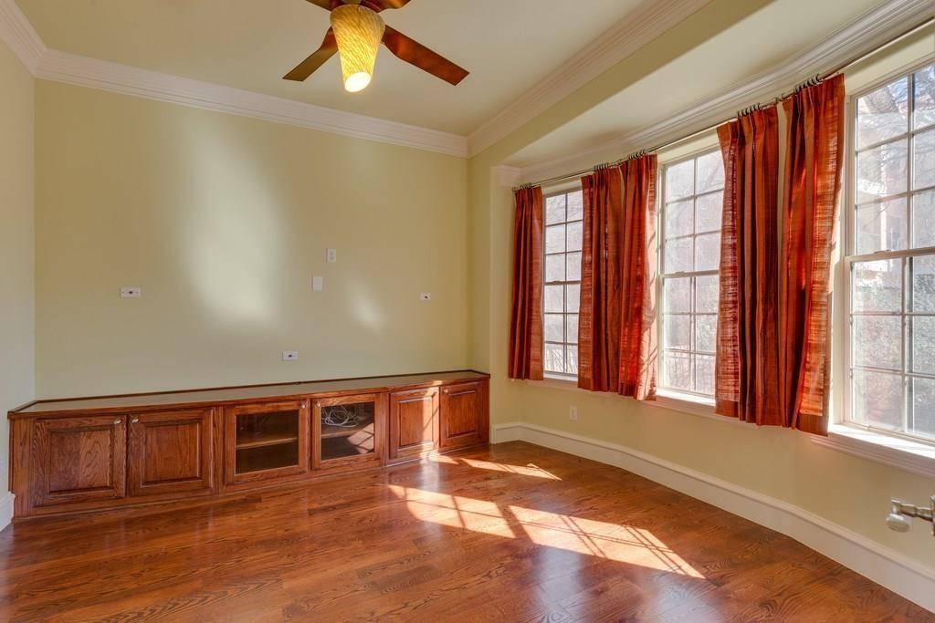566 Rockingham Drive Irving, TX 75063 - Photo 12 of 22 a view of an empty room with window and wooden floor