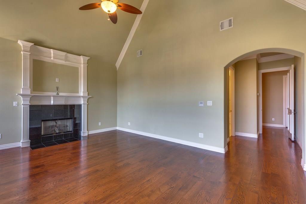 566 Rockingham Drive Irving, TX 75063 - Photo 14 of 22 a view of a livingroom with a fireplace wooden floor and window
