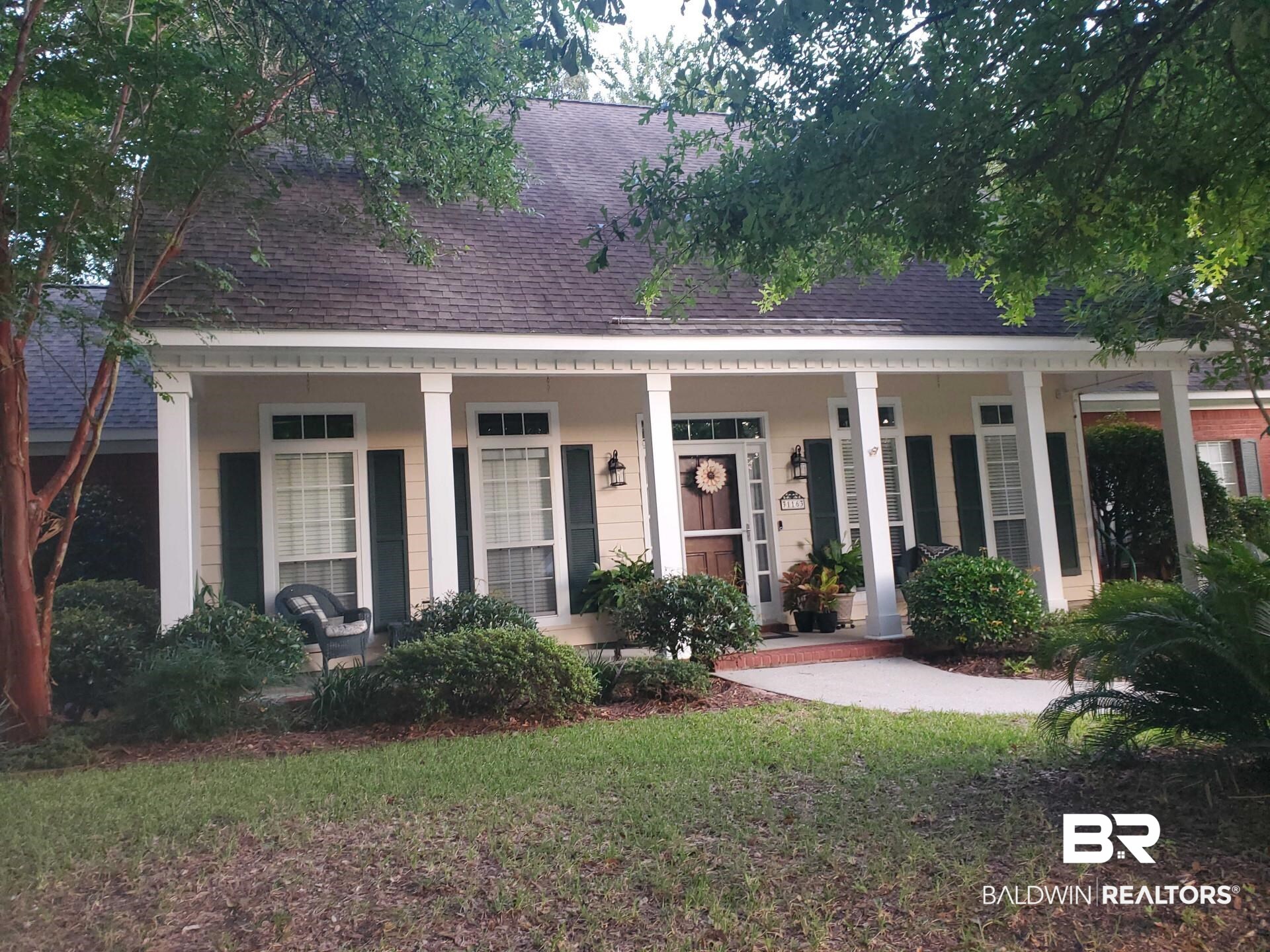 31163 Woodland Way Daphne, AL 36527 - Photo 2 of 44 View of front of house with a porch and a front yard