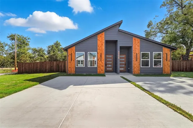a front view of a house with yard