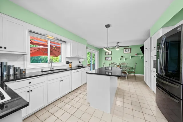 a kitchen with sink cabinets and window