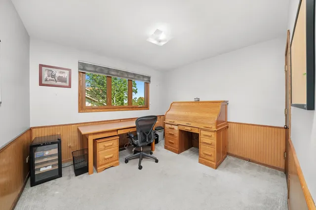 a view of workspace with furniture and window