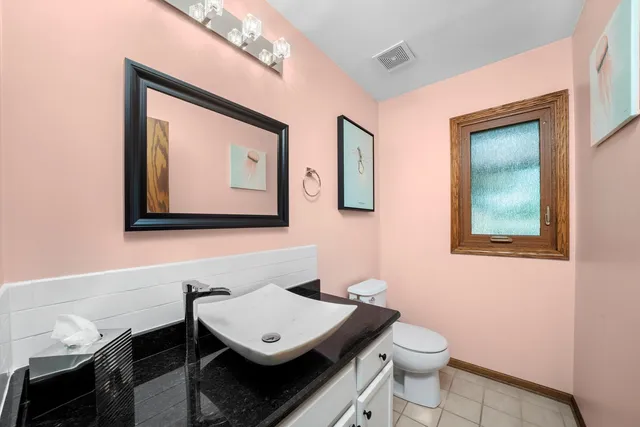 a view of a bathroom with a sink and a mirror