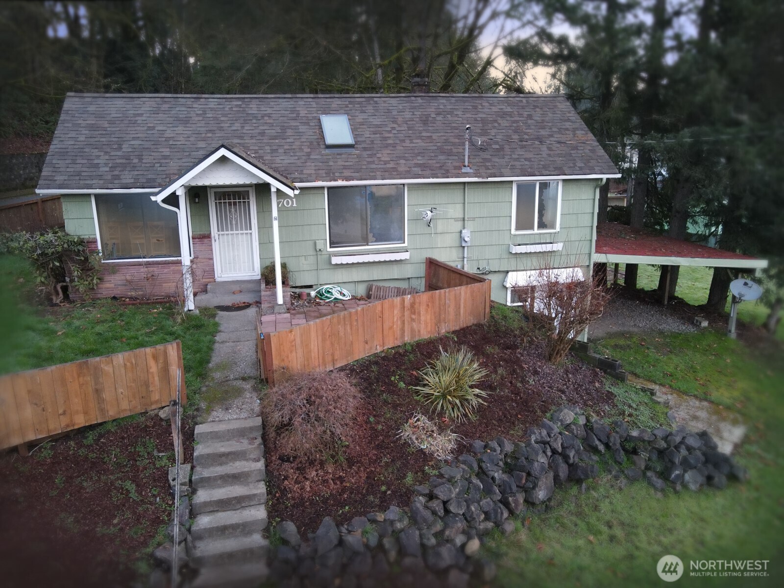 701 Northwest Dexter Avenue Winlock, WA 98596 - Photo 1 of 26 a front view of a house with a yard and outdoor seating