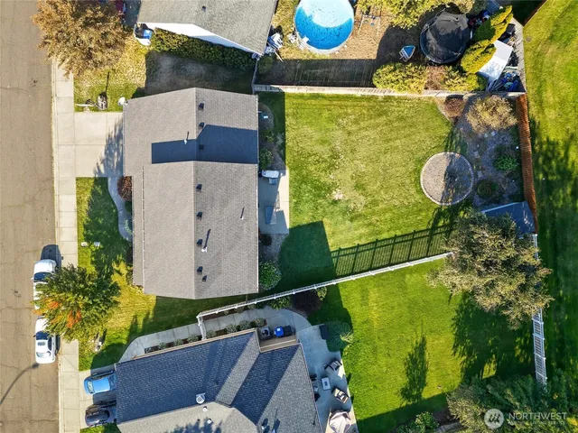 an aerial view of a house with a swimming pool