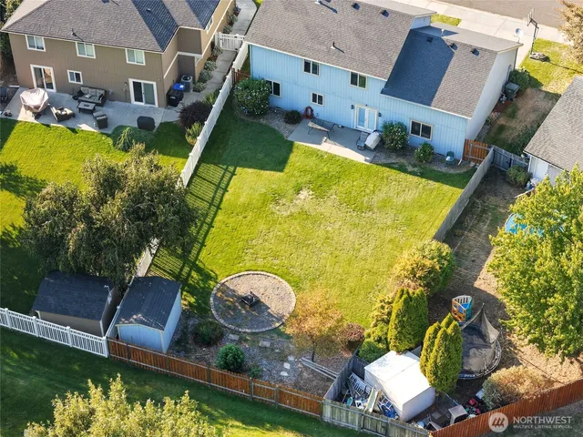 an aerial view of a house with swimming pool