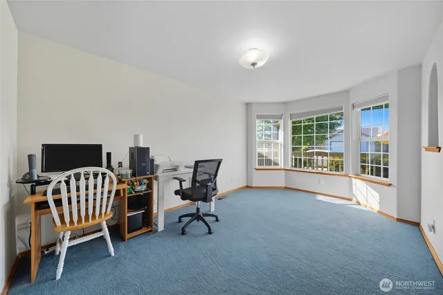 a bedroom with furniture and a window